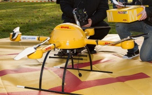 "Package copter microdrones dhl" by Frankhöffner - Own work. Licensed under CC BY-SA 3.0 via Wikimedia Commons - http://commons.wikimedia.org/wiki/File:Package_copter_microdrones_dhl.jpg#/media/File:Package_copter_microdrones_dhl.jpg
